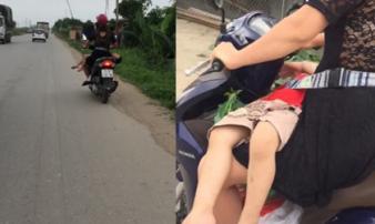 Thót tim cảnh mẹ 'vắt ngang' con trên đùi rồi bình thản lái xe Thót tim cảnh mẹ 'vắt ngang' con trên đùi rồi bình thản lái xe