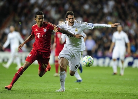 Bayern Munich's Brazilian midfielder Luiz Gustavo (L) vies for the ball with Real Madrid's Brazilian midfielder Kaka (R) during the UEFA Champions League second leg semi-final football match Real Madrid against Bayern Munich at the Santiago Bernabeu stadium in Madrid on April 25, 2012.