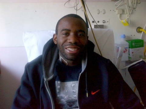 Bolton Wanderers footballer Fabrice Muamba poses for a photograph in the London Chest Hospital in east London March 30, 2012. The photograph, released by members of Muamba's family on Twitter,  shows Muamba, who had a cardiac arrest while playing against Tottenham Hotspur on March 17, sitting in his hotel room on Friday.