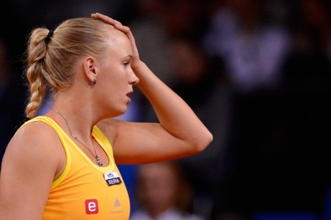 STUTTGART, GERMANY - APRIL 25:  Caroline Wozniacki of Denmark reacts during her match against Jelena Jankovic of Serbia during day three of the WTA Porsche Tennis Grand Prix at Porsche Arena on April 25, 2012 in Stuttgart, Germany.