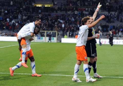 Montpellier's players celebrate at the end of the French L1 football match Toulouse vs Montpellier, on April 27, 2012 at the Stadium Municipal in Toulouse, south western France.