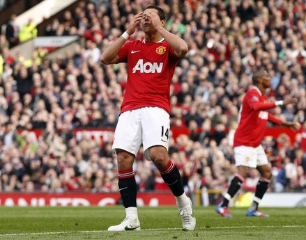 Manchester United's Javier Hernandez reacts after missing a chance to score during their English Premier League soccer match against Swansea City at Old Trafford in Manchester, northern England, May 6, 2012.