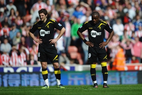 STOKE ON TRENT, ENGLAND - MAY 13:  Nigel Reo-Coker (L) and Sam Ricketts of Bolton Wanderers looks despondent during the Barclays Premier League match between Stoke City and Bolton Wanderers at Britannia Stadium on May 13, 2012 in Stoke on Trent, England.