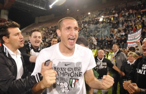 Juventus' Giorgio Chiellini celebrates with fans after winning the Italian Serie A title at the end of the match against Cagliari at the Nereo Rocco stadium in Trieste May 6, 2012. Juventus won Serie A for the first time since the Calciopoli match-fixing scandal on Sunday, clinching the title with a 2-0 win at Calgiari as AC Milan lost 4-2 to arch-rivals Inter in a stormy derby.