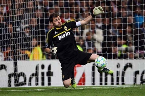 MADRID, SPAIN - APRIL 25: Iker Casillas of Real Madrid saves a penalty of Philipp Lahm of Bayern (not in the picture) during the UEFA Champions League semi final second leg match between Real Madrid and Bayern Muenchen at Bernabeu Stadium on April 25, 2012 in Madrid, Spain.