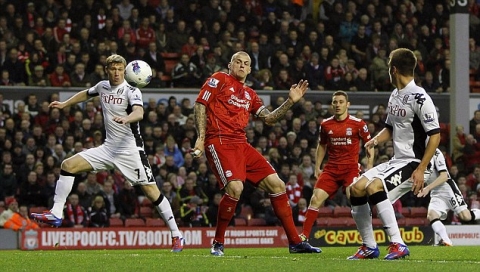 Oops: Martin Skrtel shoulders the ball into his own net against Fulham at Anfield