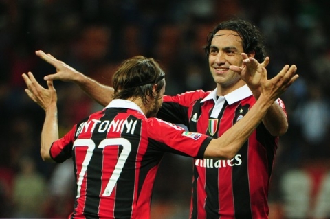 AC Milan's defender Alessandro Nesta (R) celebrates with AC Milan's defender Luca Antonini after the Italian seria A match between AC Milan and Atalanta, on May 2, 2012, at the San Siro stadium in Milan.