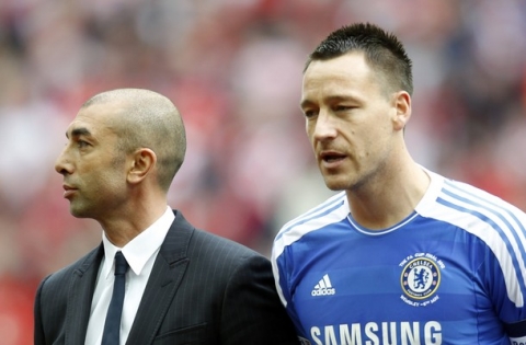 Chelsea's interim manager Roberto Di Matteo (L) and English defender John Terry (R) stand next to each other before the start of the English FA Cup final football match between Liverpool and Chelsea at Wembley Stadium in London on May 5, 2012.