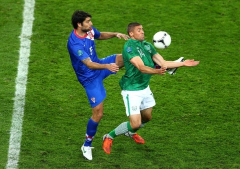 POZNAN, POLAND - JUNE 10:  Vedran Corluka of Croatia and  Jonathan Walters of Republic of Ireland compete for the ball during the UEFA EURO 2012 group C between Ireland and Croatia at The Municipal Stadium on June 10, 2012 in Poznan, Poland.