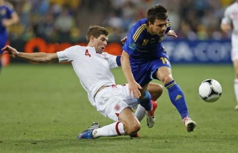 England's Steven Gerrard and Ukraine's Yevhen Konoplyanka go for the ball  during the Euro 2012 soccer championship Group D match between England and Ukraine in Donetsk, Ukraine, Tuesday, June 19, 2012.