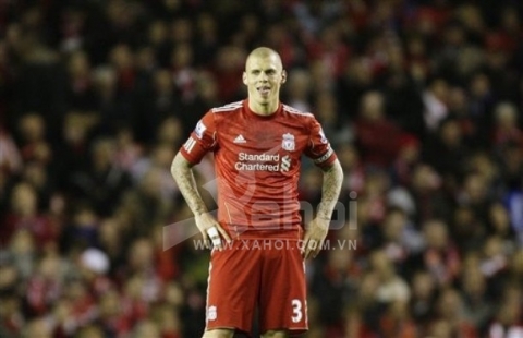 Liverpool's captain Martin Skrtel stands hands on hips as his side are beaten 1-0 by Fulham their English Premier League soccer match at Anfield Stadium, Liverpool, England, Tuesday, May 1, 2012.