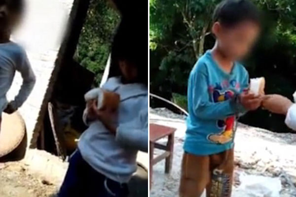 Thấy cậu bé bị bỏ đói, một cô gái đã đưa bánh mì cho em ăn.