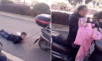 Sốc: Mẹ trói tay con trai vào xe máy kéo lê trên đường vì... nghịch