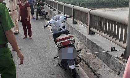 Để lại xe máy trên thành cầu Yên Lệnh, cô gái trẻ vội gieo mình xuống sông Hồng tự tử