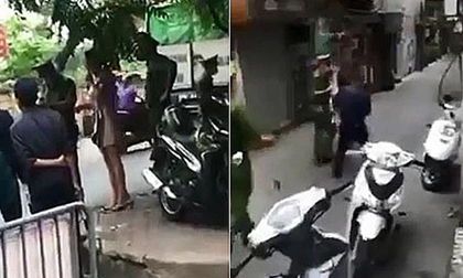 Hà Nội: Ra đường không lý do, người phụ nữ lấy 2 con dao dọa tổ công tác ai vào gần sẽ đâm chết