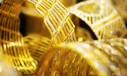 Vàng bốc hơi 100 USD/ounce, thủng mốc 1.980 USD trong đêm