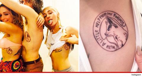 Miley vén áo khoe hình xăm cún cưng