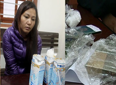 Nguyễn Thị Hương cùng những hộp sữa có cất giấu ma túy “đá” và tang vật 6 bánh heroin