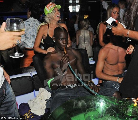 Living the dream: As the 21-year-old footballer had his stresses rubbed away the blonde tried his hat on for size