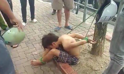Hà Nội: Hình ảnh cậu bé bị trói chân tay vào gốc cây gây xôn xao